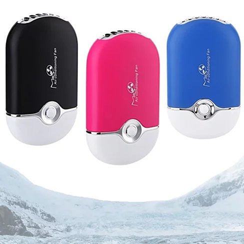 Porta Cooler Portable Air Conditioning USB powered personal mini fan on desk with green charging indicator